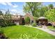 Charming backyard with manicured lawn and a cozy patio area at 615 N Williams St, Denver, CO 80218