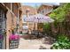 Outdoor space with a patio featuring a dining table, stainless steel grill, and landscaped surroundings at 615 N Williams St, Denver, CO 80218