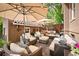 Inviting backyard patio featuring comfortable seating, umbrellas, and a charming outdoor living space at 615 N Williams St, Denver, CO 80218