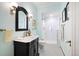 Elegant bathroom featuring a vintage vanity with marble top and a walk-in glass shower at 615 N Williams St, Denver, CO 80218