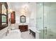 Spacious bathroom with and sinks, a soaking tub and an enclosed glass shower at 615 N Williams St, Denver, CO 80218