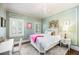Cozy bedroom with decorative molding, a plush rug, and neutral color palette at 615 N Williams St, Denver, CO 80218