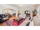 Open concept living room showcasing arched entryways, hardwood floors and decorative oriental rug at 615 N Williams St, Denver, CO 80218