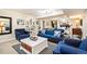 Cozy living room with a fireplace and comfortable blue seating at 615 N Williams St, Denver, CO 80218