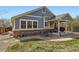 Backyard exterior featuring a patio area with outdoor seating, grill, and lush green lawn at 20040 E Doane Dr, Aurora, CO 80013