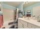 Traditional bathroom with a shower-tub combination and a white vanity, creating a clean and functional space at 20040 E Doane Dr, Aurora, CO 80013