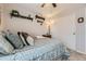 Charming bedroom featuring carpet, decorative shelves, and a closet, offering comfort and storage at 20040 E Doane Dr, Aurora, CO 80013