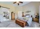 Spacious bedroom featuring plush carpet, large windows, and a wooden chest, offering serene comfort at 20040 E Doane Dr, Aurora, CO 80013