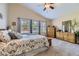 Large bedroom featuring a vaulted ceiling, neutral carpet, and windows, offering a peaceful retreat at 20040 E Doane Dr, Aurora, CO 80013