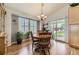 Cozy dining room featuring a wooden table with seating, light fixture, and outdoor access at 20040 E Doane Dr, Aurora, CO 80013
