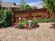 Charming backyard garden featuring colorful flowers, lush greenery, a birdbath, and decorative stone ground cover at 20040 E Doane Dr, Aurora, CO 80013