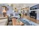 Open-concept living room showcasing hardwood floors, and a view into the kitchen at 20040 E Doane Dr, Aurora, CO 80013