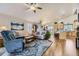 Bright living room featuring wood floors, vaulted ceilings, neutral walls, and stylish furnishings at 20040 E Doane Dr, Aurora, CO 80013