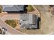Aerial view of a home showing the roof, driveway, and landscaping in a well-maintained neighborhood at 10869 Bluffside Dr, Lone Tree, CO 80124