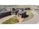 Stunning aerial view of a home nestled in a picturesque neighborhood with mountain backdrop at 10869 Bluffside Dr, Lone Tree, CO 80124