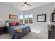 Cozy bedroom with natural light, corner windows, and neutral decor at 10869 Bluffside Dr, Lone Tree, CO 80124