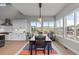 Bright dining room with large windows and views of the exterior landscape at 10869 Bluffside Dr, Lone Tree, CO 80124