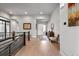 Lovely foyer with stylish console table, decor, and hardwood floors at 10869 Bluffside Dr, Lone Tree, CO 80124