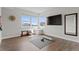 Spacious exercise room with ample natural light and hardwood floors, ready for a workout session at 10869 Bluffside Dr, Lone Tree, CO 80124