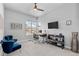 Bright home office with stylish furnishings, sleek ceiling fan, and a large window offering scenic mountain views at 10869 Bluffside Dr, Lone Tree, CO 80124