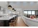 Spacious open concept kitchen with large island, adjacent dining area and living room at 10869 Bluffside Dr, Lone Tree, CO 80124