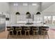Bright kitchen featuring a large island with seating and stainless steel appliances at 10869 Bluffside Dr, Lone Tree, CO 80124