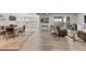 Spacious living room with light flooring, large windows, sliding doors to outside, and comfortable seating at 10869 Bluffside Dr, Lone Tree, CO 80124