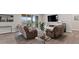 Bright living room with modern decor, sliding glass doors to balcony, hardwood floors, and comfortable seating at 10869 Bluffside Dr, Lone Tree, CO 80124