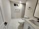 Basement bathroom with hexagon tile floor, shower, and modern vanity at 8318 Benton Way, Arvada, CO 80003