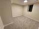 Spacious finished basement bedroom with neutral carpeting at 8318 Benton Way, Arvada, CO 80003