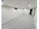 Unfinished basement with neutral carpeting at 8318 Benton Way, Arvada, CO 80003