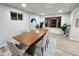 Bright dining room with wood table and bay window at 8318 Benton Way, Arvada, CO 80003