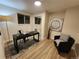 Home office with a desk, chair, and large art piece at 8318 Benton Way, Arvada, CO 80003