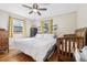 Bright bedroom with hardwood floors, natural light, and built-in shelves at 1975 Cody St, Lakewood, CO 80215