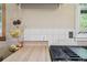 Modern kitchen with butcher block countertop, gas range and decorative tile backsplash at 1975 Cody St, Lakewood, CO 80215