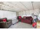 Cozy living room featuring comfortable seating, whitewashed ceiling, and a whiteboard at 1975 Cody St, Lakewood, CO 80215