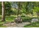 Sculpture of tortoises found in a park, surrounded by greenery and trees at 1975 Cody St, Lakewood, CO 80215