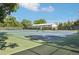 Blue and green tennis courts with nets, ideal for sports enthusiasts at 1975 Cody St, Lakewood, CO 80215