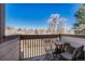 Charming balcony with seating and neighborhood view at 701 Harlan St # E72, Lakewood, CO 80214