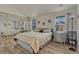 Cozy bedroom with ample natural light, mirrored closet, and neutral decor for a serene retreat at 701 Harlan St # E72, Lakewood, CO 80214