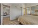 Stylish bedroom with modern sliding closet doors and adjoining room at 701 Harlan St # E72, Lakewood, CO 80214