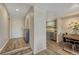 Inviting entryway with wood floors leading to the kitchen and dining area at 701 Harlan St # E72, Lakewood, CO 80214