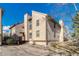 View of an exterior corner and siding of a multi-level townhome building at 701 Harlan St # E72, Lakewood, CO 80214