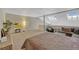 Cozy living room featuring skylights, plush seating, and neutral tones at 701 Harlan St # E72, Lakewood, CO 80214