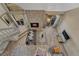 Aerial view of a living room with a fireplace, hardwood floors, and seating at 701 Harlan St # E72, Lakewood, CO 80214