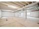 Unfinished basement with high ceilings and ample space at 1547 Orchard St, Brighton, CO 80601