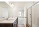 Bathroom boasts double sinks, quartz countertop, and a shower at 1547 Orchard St, Brighton, CO 80601