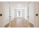 Bright bedroom with hardwood floors and mirrored closet doors at 1547 Orchard St, Brighton, CO 80601