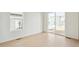 Dining area with sliding glass door to backyard and light flooring at 1547 Orchard St, Brighton, CO 80601