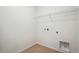 Laundry room with wire shelving and wood flooring at 1547 Orchard St, Brighton, CO 80601